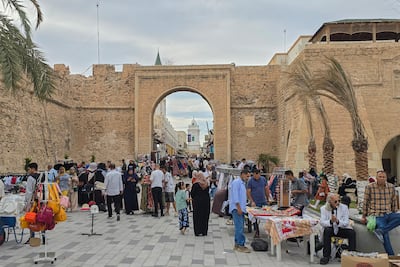 People walk in the old town of Libya's capital Tripoli. AFP
