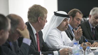 Dr Mohammed Al Mualla, senior vice president of research and development, Khalifa University, centre, and Dr Tod Laursen, university president, third from left, host the UAE-UK industry event. Mona Al Marzooqi / The National