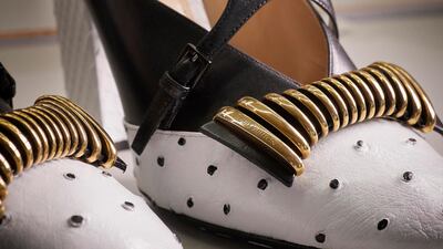 A finished pair of Headline shoes in python, black leather and white ostrich leather with black dots painted by hand. Louis Vuitton Malletier / Grégoire Vieille