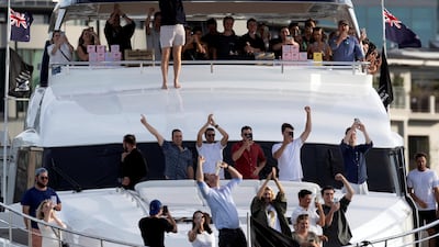 Spectators celebrate Emirates Team New Zealand victory at the 36th America's Cup in Auckland. The price of happiness in New Zealand is $128,844 annually. Photo: AFP
