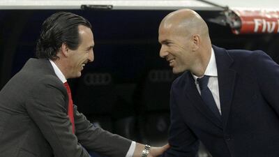 Real Madrid’s coach Zinedine Zidane greets Sevilla’s coach Unai Emery before match. REUTERS/Sergio Perez