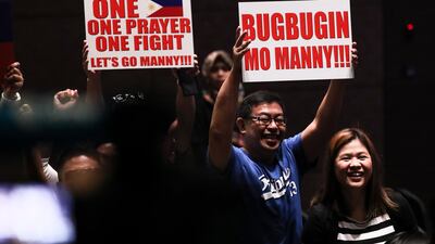 Supporters of Manny Pacquiao cheer as he arrives. EPA