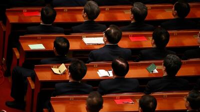 Attendees listen to Chinese President Xi Jinping's speech during an anniversary event celebrating the 200th year of the birth of Karl Marx at the Great Hall of the People in Beijing, China. Xi also instructed all party members to adopt the reading of Marxist works and the understanding of Marxist theories as a "way of life" and a "spiritual pursuit". How Hwee Young / EPA