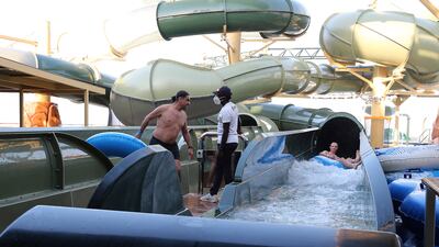 Passengers enjoy the aqua park as the ship is docked in Dubai