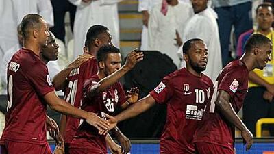 Al Wahda players show their relief after beating Hekari in the opening match of the Club World Cup.