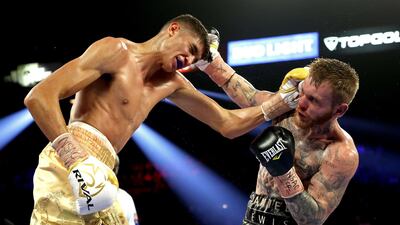 Sebastian Fundora (L) and Daniel Lewis exchange punches during their junior middleweight bout at MGM Grand Garden Arena in Las Vegas. AFP