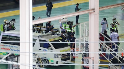 Rescuers arrive at the scene, with at least 15 people injured in the attack. Reuters