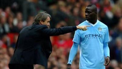 Roberto Mancini, left, and Mario Balotelli had a public row at Manchester City's training ground.