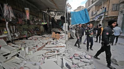 Syrians gather at the site of a regime air strike in Ariha. AFP