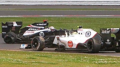Pastor Maldonado, left, was also involved in a collision with Kamui Kobayashi. Geoff Caddick / EPA