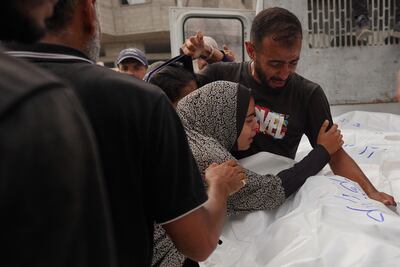 Relatives mourn the death of family members in Khan Younis on Sunday. If elected, Donald Trump is unlikely to persuade Israel to end the war in Gaza – despite the mounting death toll. AFP