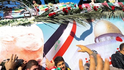The coffins of slain top commander Qasem Soleimani and Iraqi paramilitary chief Abu Mahdi al-Muhandis, are transported atop a vehicle upon their arrival at Ahvaz International Airport in southwestern Iran on January 5, 2020. AFP