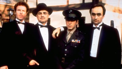 From left, James Caan as Sonny Corleone, Marlon Brando as Don Vito Corleone, Al Pacino as Michael Corleone and John Cazale as Fredo Corleone from the 1972 film 'The Godfather'. Paramount Pictures / AP