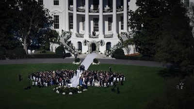 The south side of the White House, facing the lawn and Washington Monument, was decorated with wreaths and garlands bearing white flowers. AFP