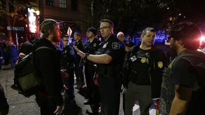 Police confront protesters during a demonstration against president-elect Donald Trump in Seattle's Capitol Hill neighborhood. Ted Warren / AP Photo