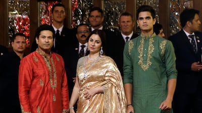 Formet Indian cricketer Sachin Tendulkar, his wife Anjali and son Arjun arrive. AP Photo