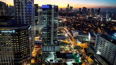 The Manila skyline. UAE-based Filipinos are confident about investing in the Philippines property market and the economic plans of the new government would seem to bear that out, real estate experts say. Sanjit Das / Bloomberg