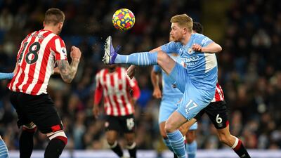 De Bruyne juggles the ball watched by Brentford's Jansson. PA