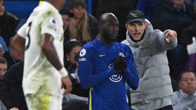 Chelsea's manager Thomas Tuchel talks to Romelu Lukaku during the Premier League match against Leeds United on December 11, 2021. EPA