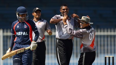 Gyanendra Mall of Nepal walks back to the pavilion after being dismissed by Manjula Guruge during the ACC Elite Trophy in 2012. Satish Kumar/The National