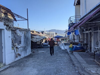 Damage from the latest war with Azerbaijan is still visible in the market in Stepanakert, the main city in the Nagorno-Karabakh region. Neil Hauer for The National