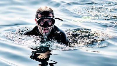 Crown Prince Frederik swims with tuna as he takes part in tuna tagging in the waters off Skagen, Denmark, in 2021. EPA