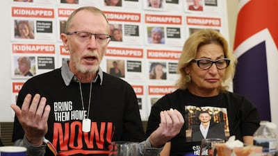 Thomas Hand (L) whose nine-year-old daughter Emily Hand is believed kidnapped by Hamas and Orit Meir (R) speak at a press conference of family members of Israeli hostages. EPA