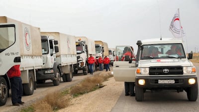 An aid convoy of the Syrian Red Crescent arriving at the Rukban desert camp for displaced Syrians along Syria's border with Jordan on February 06, 2019. AFP