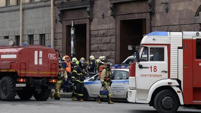 Emergency services personnel walk at the entrance to the Technological Institute metro station in St Petersburg. Olga Maltseva / AFP