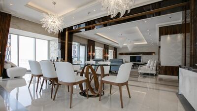 Floor-to-ceiling windows allow the natural light to flood throughout the penthouse. Courtesy Luxhabitat