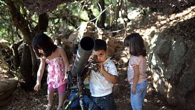 Children get a hands-on view of old Hizbollah equipment, on display to celebrate the group’s struggle against Israel, at the Mleeta resistance museum in South Lebanon. Philip Cheung
