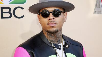 FILE PHOTO: Singer Chris Brown poses at the 2015 iHeartRadio Music Awards in Los Angeles, California, March 29, 2015. REUTERS/Danny Moloshok/File Photo