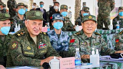 Russian Defence Minister Sergei Shoigu and Chinese Defence Minister Wei Fenghe watch a joint military exercise by Russia and China held last year. AP