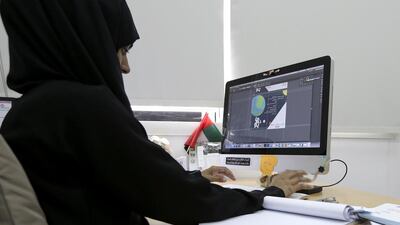Graphic designer Farhana Hakim at her job at Sharjah City for Humanitarian Services. The hearing-impaired Pakistani says her job allows her to capture her thoughts on paper and wants her work to define her. Her ambiition is to be a graphic-design brand. Jeffrey E Biteng / The National