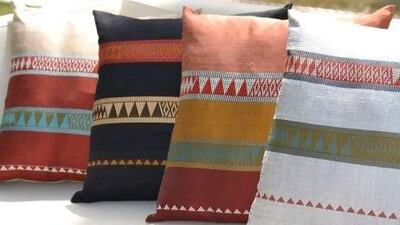 The silk cushions are hand woven at Carol Cassidy's studio in Laos. Courtesy of Zeri Crafts
