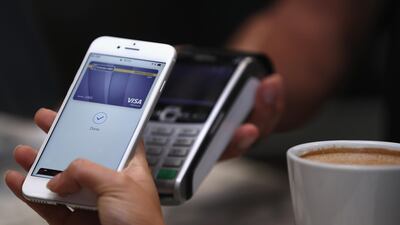 A customer makes a transaction using Apple Pay in the UAE at The Dubai Mall. Photo: Getty Images