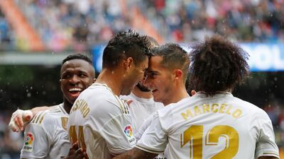 Real Madrid's Casemiro, second left, celebrates with teammates after scoring his side's third goal. AP Photo