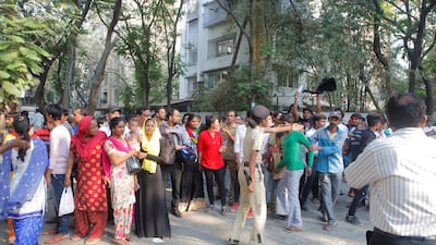 Police officers try to disperse the crowd gathered outside Sridevi's house in Mumbai. Subhash Sharma for The National