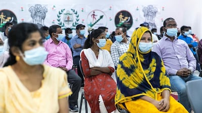Workers at the Delhi Private School in Dubai listen to V. Muraleedharan, Indian Minister of State for External Affairs speak about a programme that has been launched to help blue-collar workers learn computer skills, English and Arabic. Reem Mohammed / The National