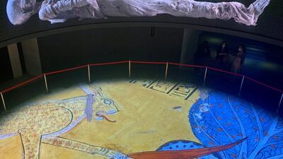 Visitors look at a large display of mummies in the National Museum of Egyptian Civilisation in Cairo, Egypt. Reuters