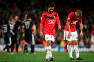 Manchester United's Nani, left, and Nemanja Vidic, leave the field as Bayern Munich players celebrate on Wednesday.