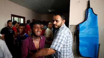 A relative of a Hamas militant killed in an Israeli tank shelling is consoled at a hospital in the northern Gaza Strip. Reuters