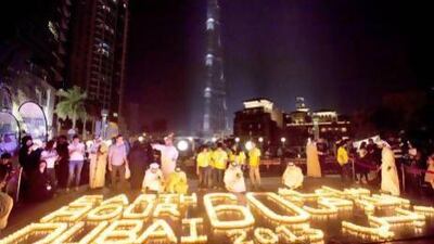 Participants around candles and lanterns during the Earth Hour 2013 Earth Hour Walk celebration at the Burj Plaza in March. Jaime Puebla / The National