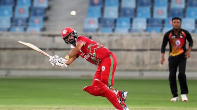 Jatinder Singh of Oman plays a shot on his way to 118 not out in the Cricket World Cup League 2 match against Papua New Guinea at Dubai International Cricket Stadium in Dubai. All photos Pawan Singh / The National