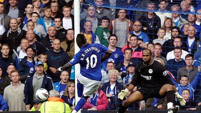 Everton's new signing Royston Drenthe curls a shot past the Wigan goalkeeper deep into injury time to complete Everton's win. It was his first goal in English football. Jon Super / AP Photo