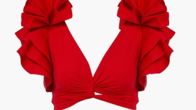 In attention-grabbing scarlet, from the statement shoulders to the upfront ruffles, this Maygel Coronel two-piece will easily do double duty at the beach during the day, and for evenings exploring town; Dh780, Maygel Coronel at bloomingdales.ae. Photo: Bloomingdales