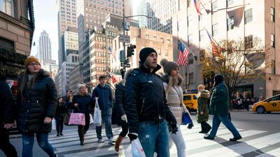 Shoppers on Fifth Avenue in New York. Consumers can now pay for smaller purchases, such as T-shirts and jeans, in instalments. Photo: AFP