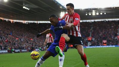 Chelsea's Didier Drogba, left, battles with Florin Gardos of Southampton for the ball during their 1-1 Premier League draw on Sunday at St Mary's Stadium. Michael Steele / Getty Images / December 28, 2014