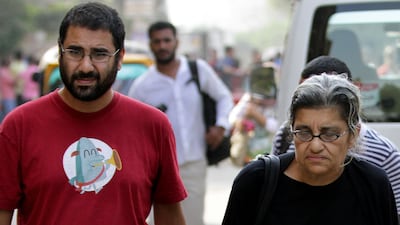 Alaa Abdel Fattah, left, a leading Egyptian pro-democracy activist, with his mother outside a court in Cairo before he was sentenced to jail. AP