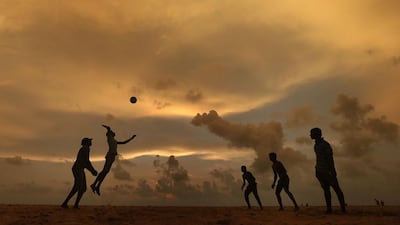 A man jumps to hit the ball while playing beach volleyball on a beach in Colombo, Sri Lanka. Dinuka Liyanawatte / Reuters / April 25, 2014